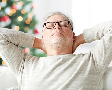 how_to_survive_a_family_christmas_man_relaxing_890x502px_1-updraft-pre-smush-original